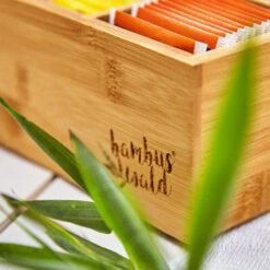 Teebox 10 Fächer 150 Teebeutel Kunststoff-Sichtfenster Bambus -Einrichtungsgeschäft 10038029 yy 0006 logo