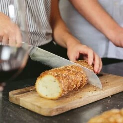 Alpha-Royal Japanese Serie 8" Brotmesser 18° Wellenschliff Damaszener-Stahl -Einrichtungsgeschäft 10038985 de 0003 logo