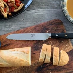 Alpha-Royal Japanese Serie 5,5" Allzweckmesser Wellen Damast-Stahl -Einrichtungsgeschäft 10038997 de 0003 logo